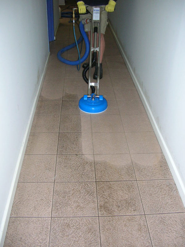 How long after grouting a floor do I have to wait before mopping?